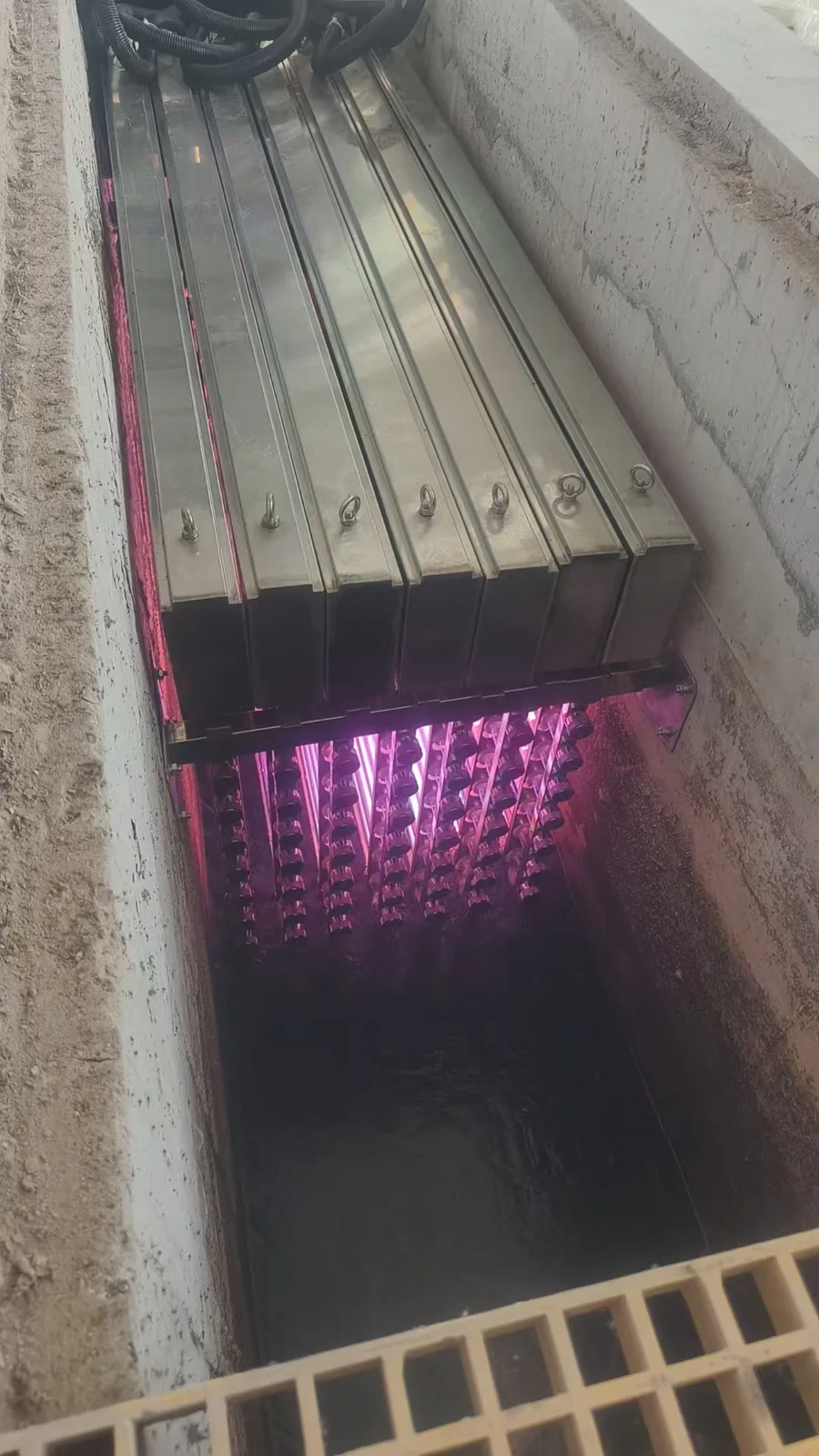 UV lamp modules installed in the wastewater treatment channel.