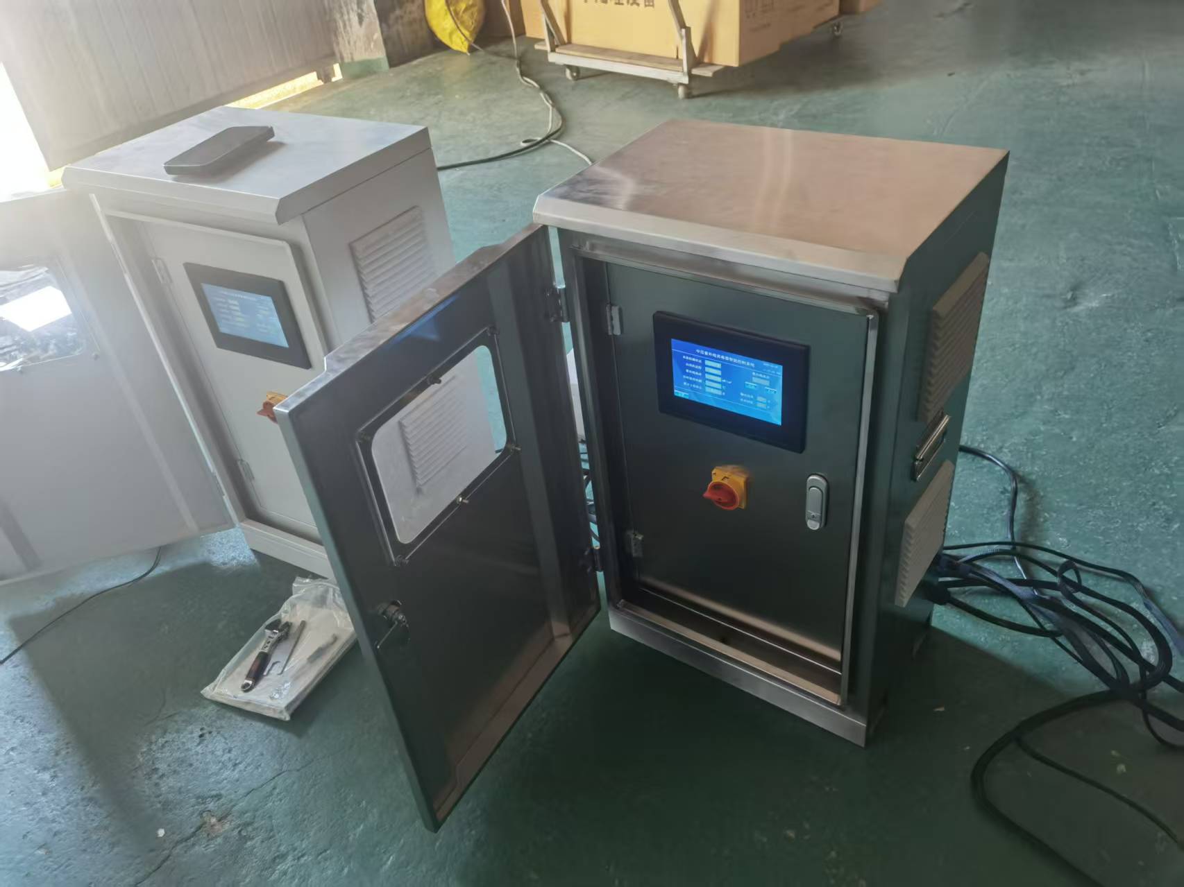 Two medium-pressure UV control cabinets during factory inspection