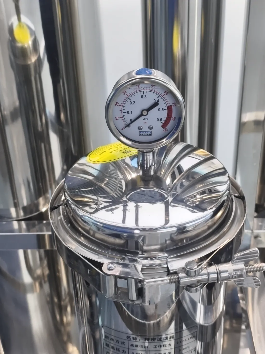 Pressure gauge and clamp-lid stainless filter housing detail